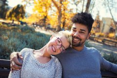 Outdoor portrait of romantic and happy mixed race young couple